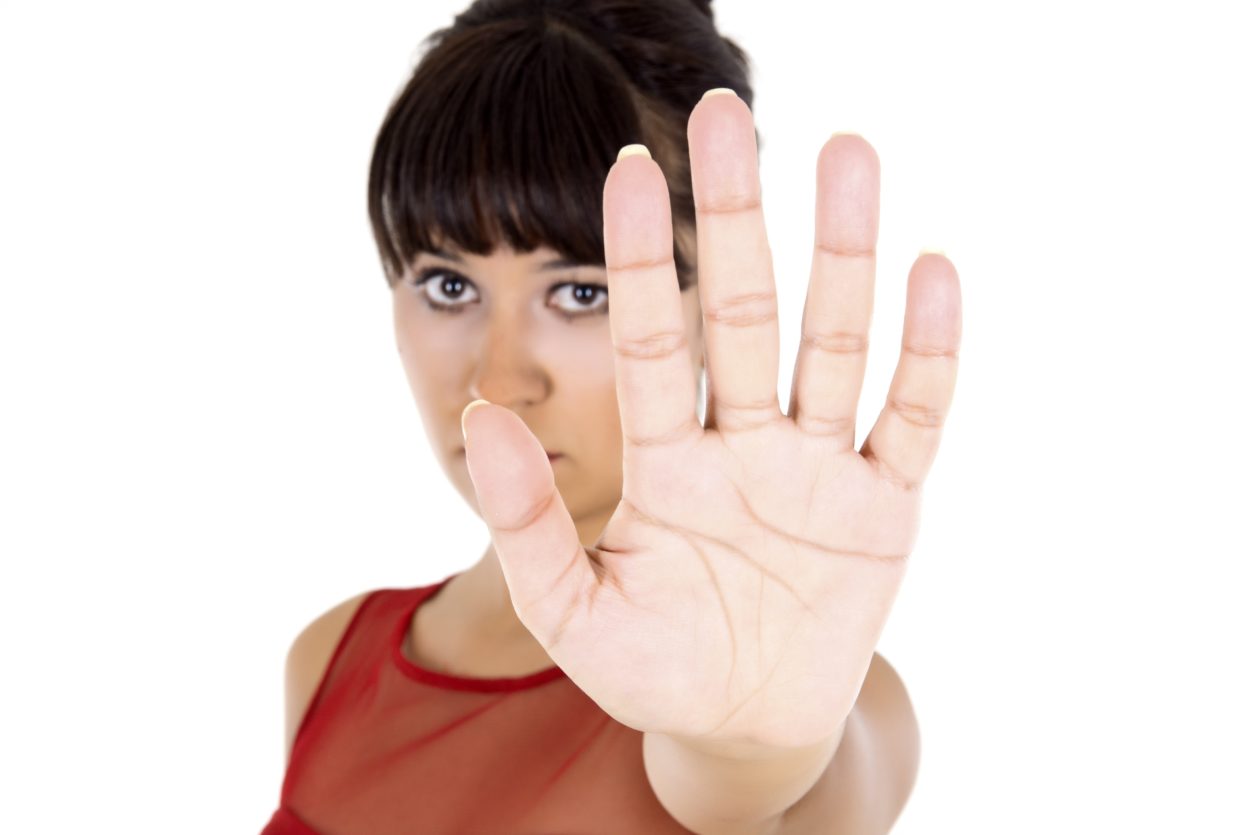 Woman signalling "Stop"