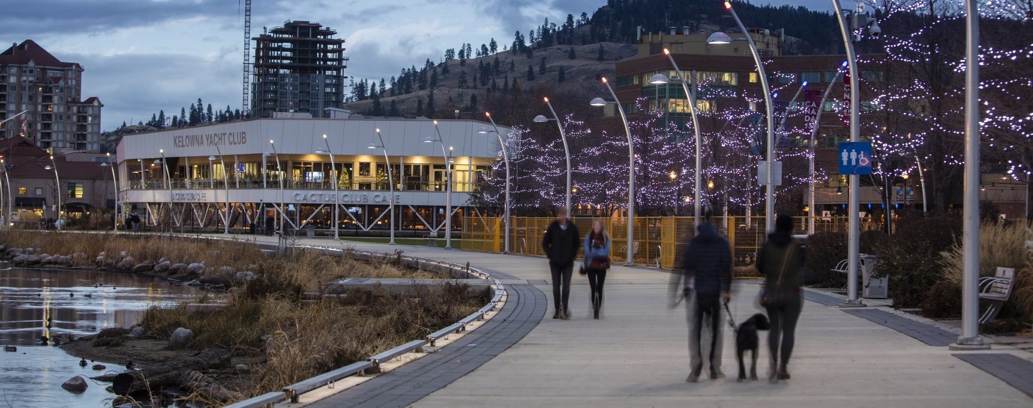Couples walking along the water in Kelowna for feature image on Wills and Estates