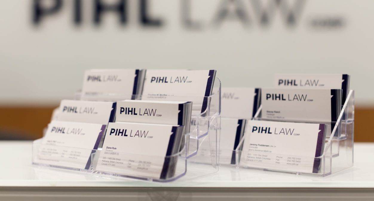 Pihl Law Business Cards in stand on desk